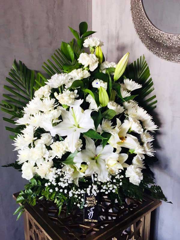 Peaceful White Lilies In A Basket Same Day Delivery BahrainGreetings